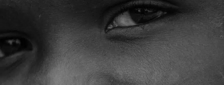 african boy black and white close up