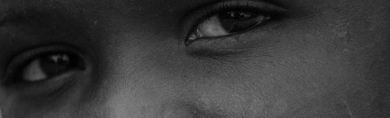 african boy black and white close up