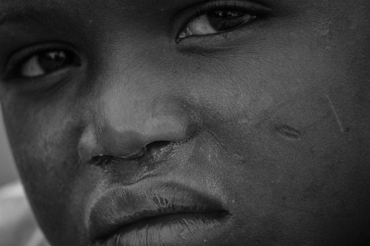 african boy black and white close up
