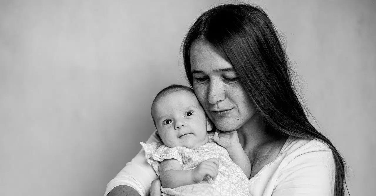 black and white picture mom with baby