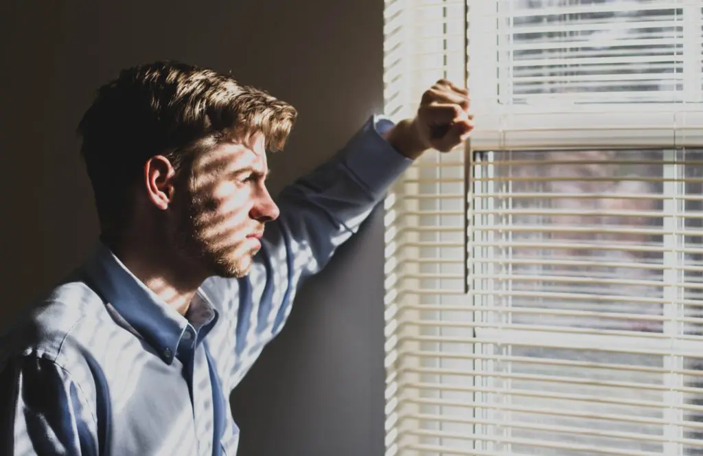 sad man at window