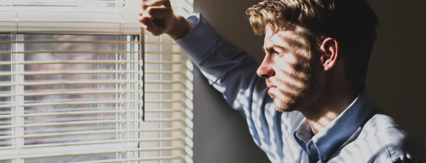 sad man at window