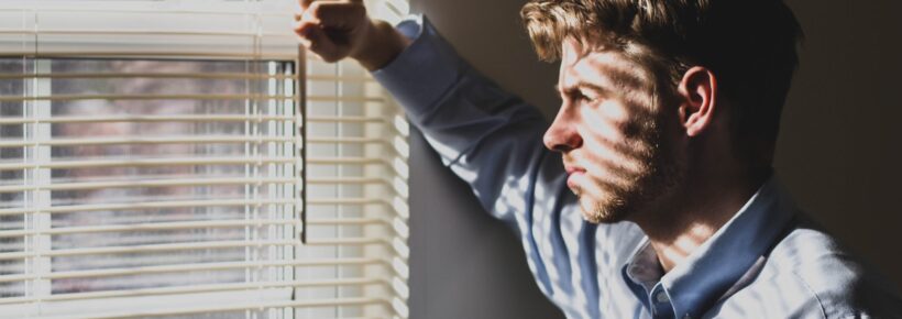 sad man at window