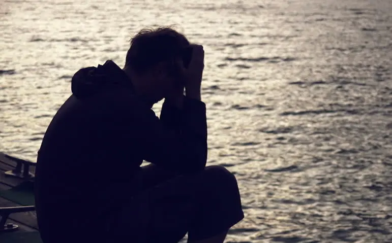 sad man on dock
