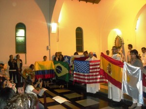 Fr. Boquet holding the US flag.