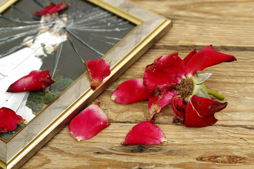 broken wedding picture with rose