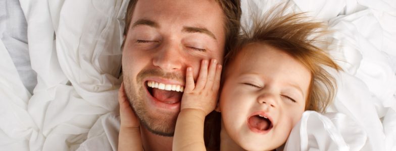 dad with toddler laughing