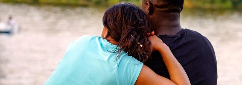 man and woman by water