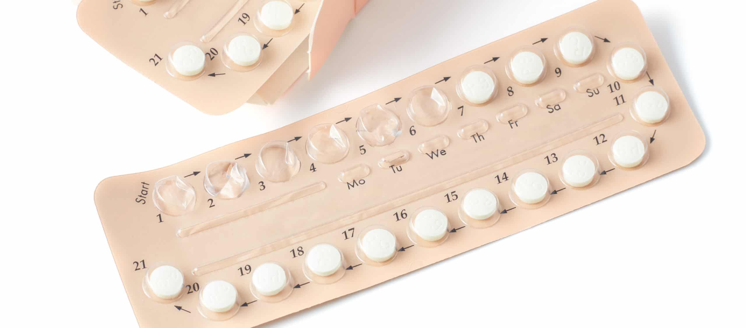 Colorful oral contraceptive pill strips isolated on white background with clipping path. birth control pill - healthcare and medicine. Strip of Contraceptive Pill with English Instructions.