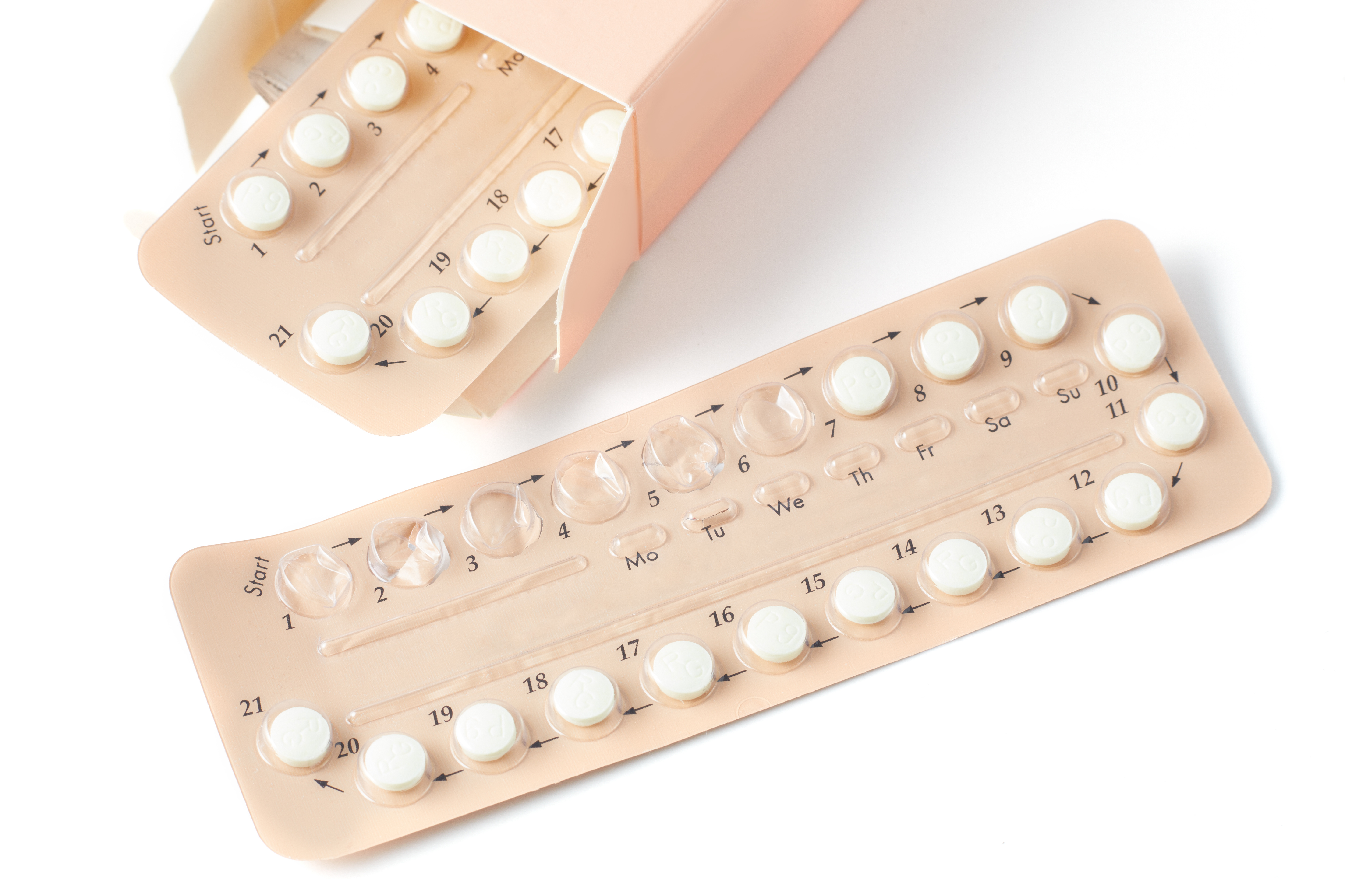 Colorful oral contraceptive pill strips isolated on white background with clipping path. birth control pill - healthcare and medicine. Strip of Contraceptive Pill with English Instructions.