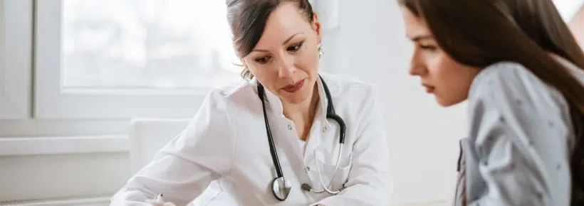 female doctor giving advice to a female patient.