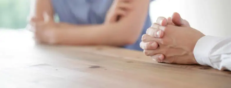 couple at table serious conversation