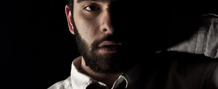 confused man in dark room