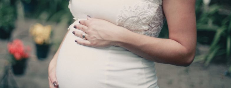 pregnant woman in white dress