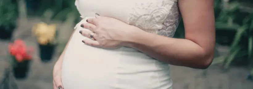 pregnant woman in white dress