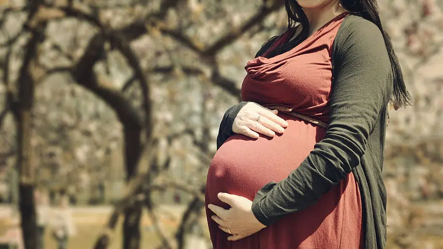 pregnant woman pink dress