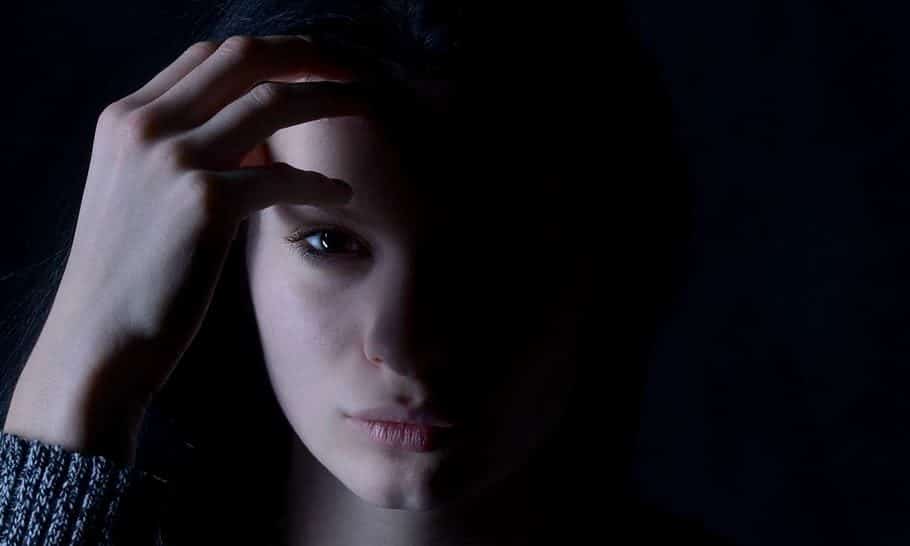 sad woman in the dark