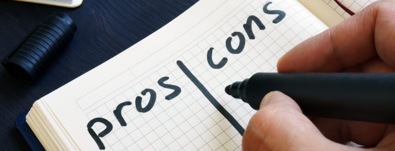 man writing list of pros and cons