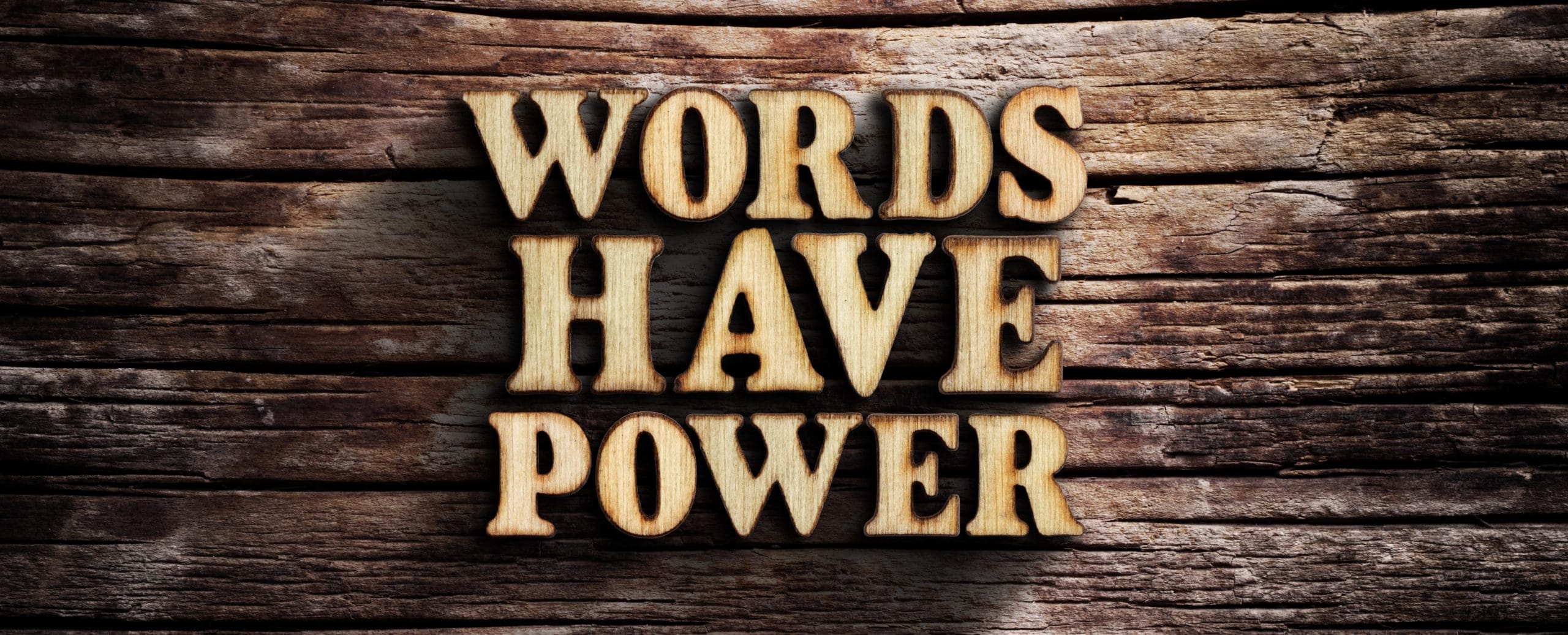 Words have power. Words on old wooden board.