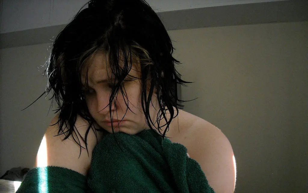 teenage girl in blanket