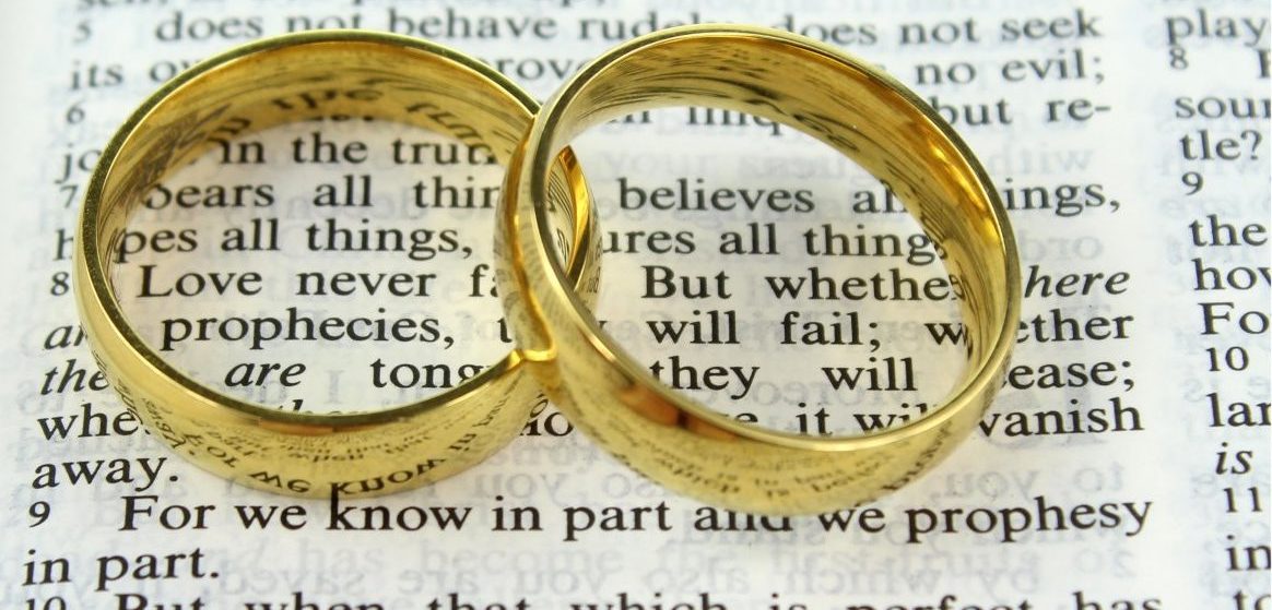 wedding rings on a bible