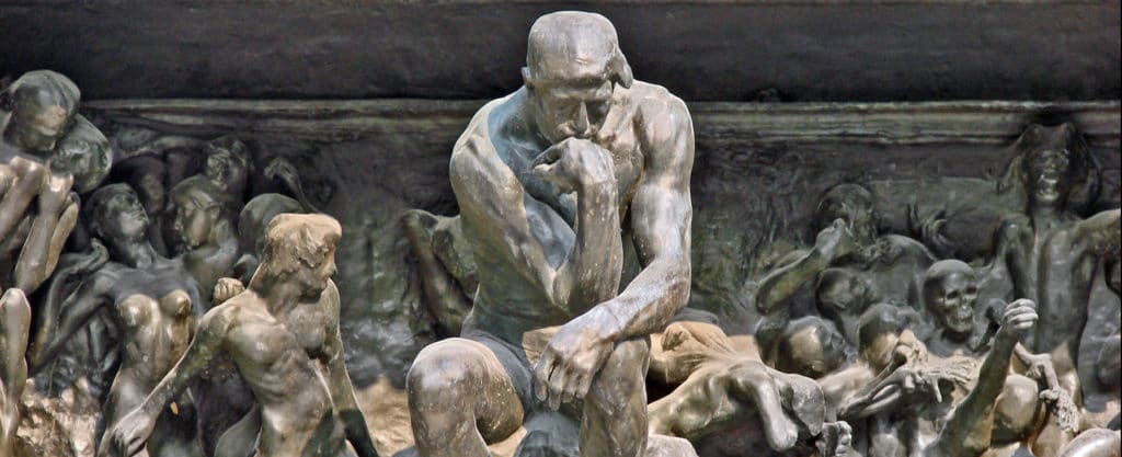 statue of man thinking