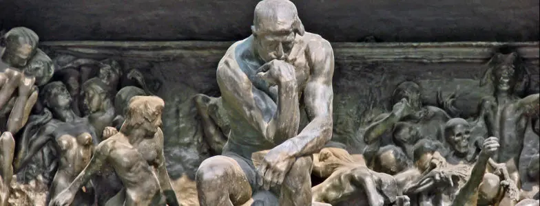statue of man thinking