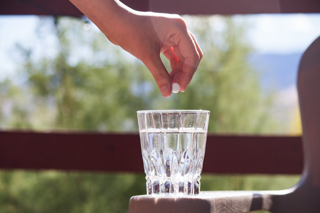 pill with glass of water