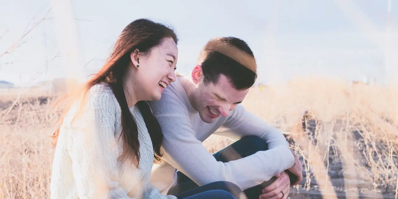 happy couple in grass