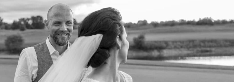 married couple black and white outside