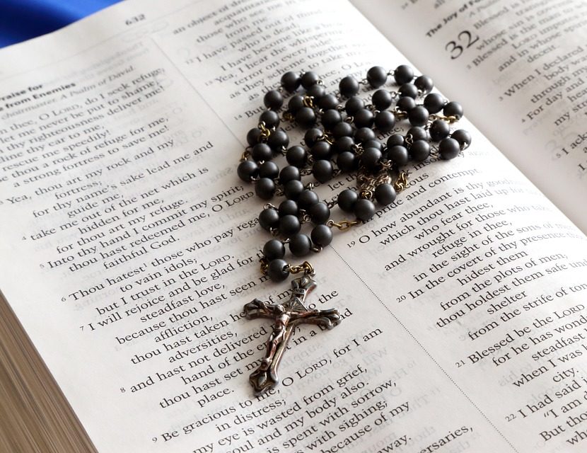 Rosary on the Bible