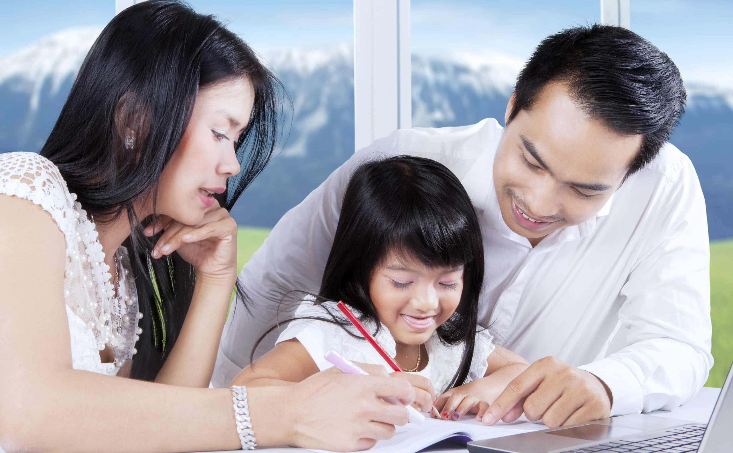 parents teaching daughter