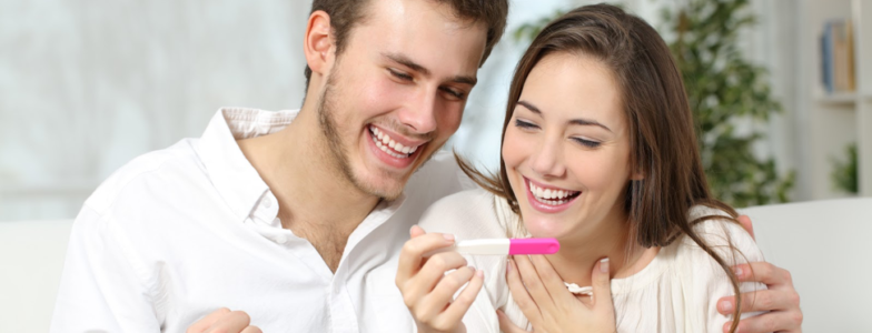 happy couple positive pregnancy test