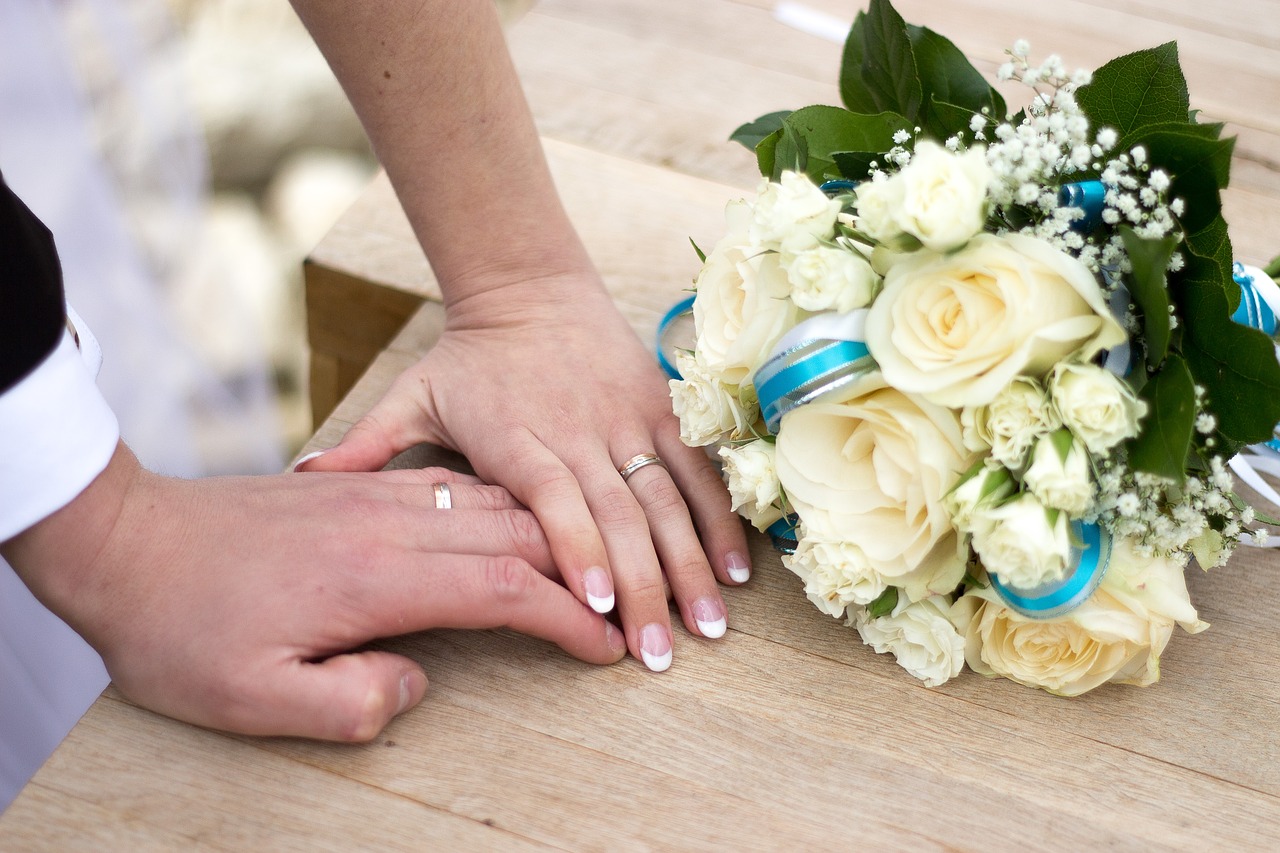 Rings Love Romantic Marriage Bouquet Wedding hands of a newly married couple