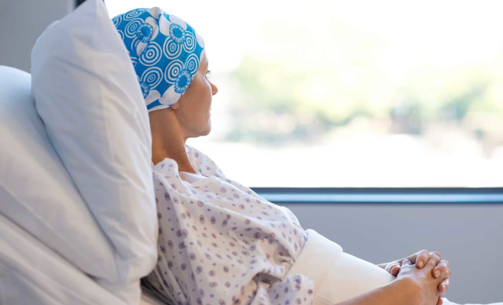 cancer patient woman looking out window