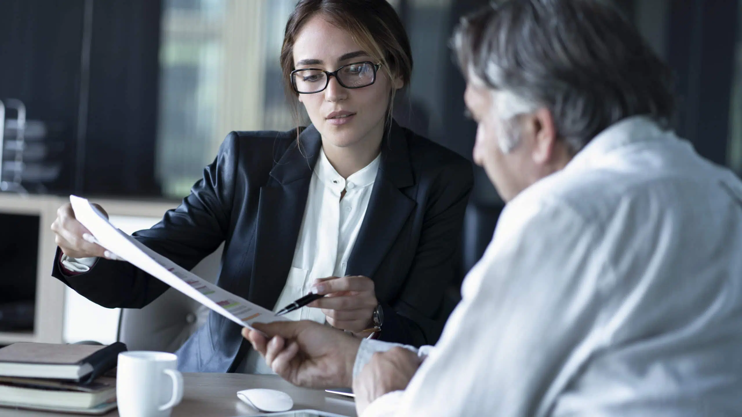 Business people discussion advisor, attorney and elderly client