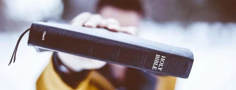 man holding bible