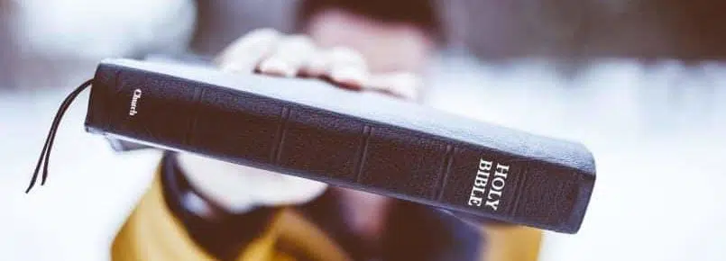 man holding bible