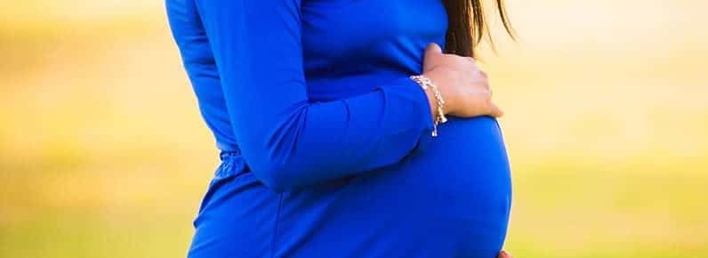 pregnant woman third trimester blue dress
