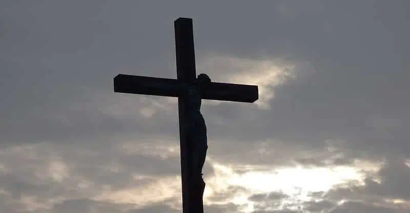 silhouette crucifix outside, catholic church teaching on euthanasia