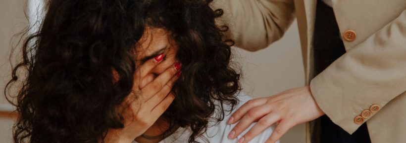 therapist comforting woman, sad