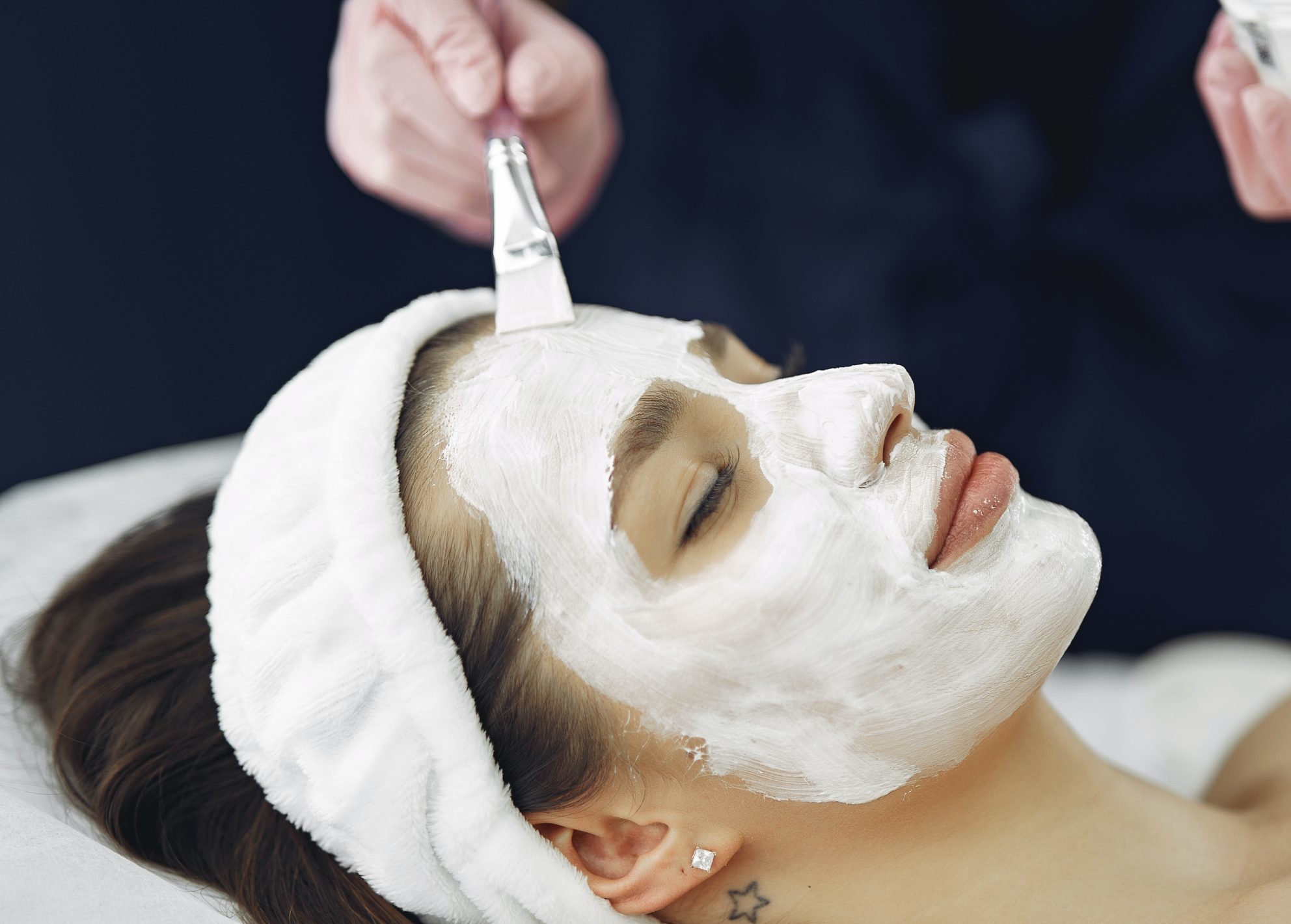 a woman getting a facial treatment