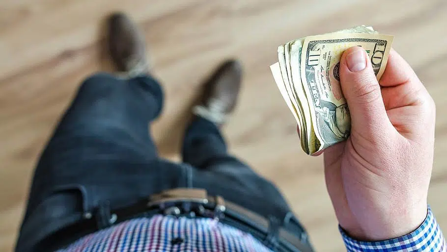 man holding cash, money
