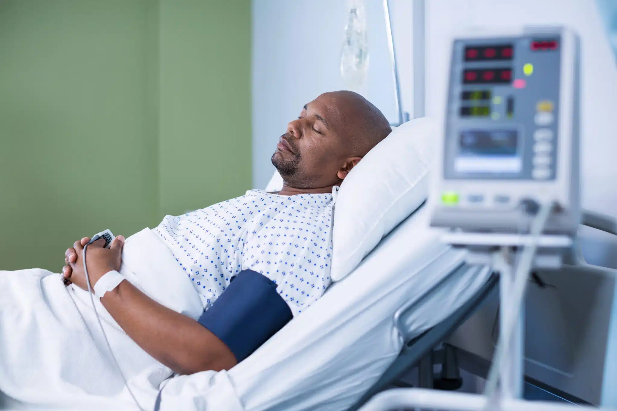 male patient resting in hospital bed