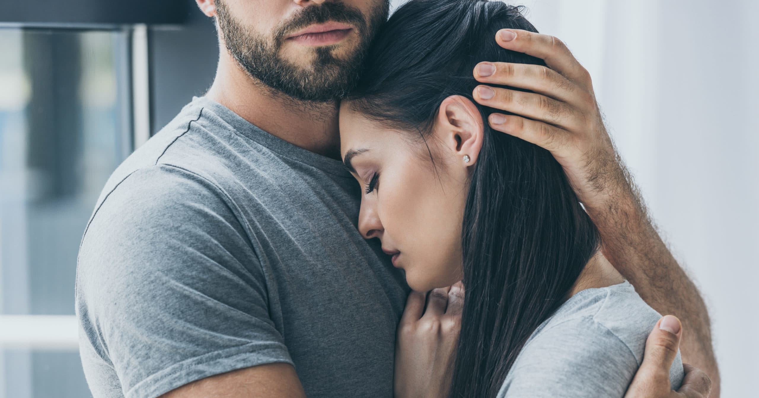 sad couple hugging, comfort