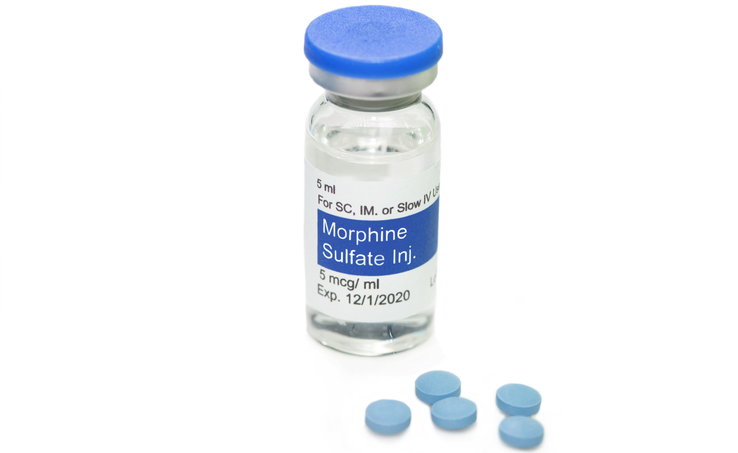 ethics of pain management - Morphine vial and blue morphine pills on white background