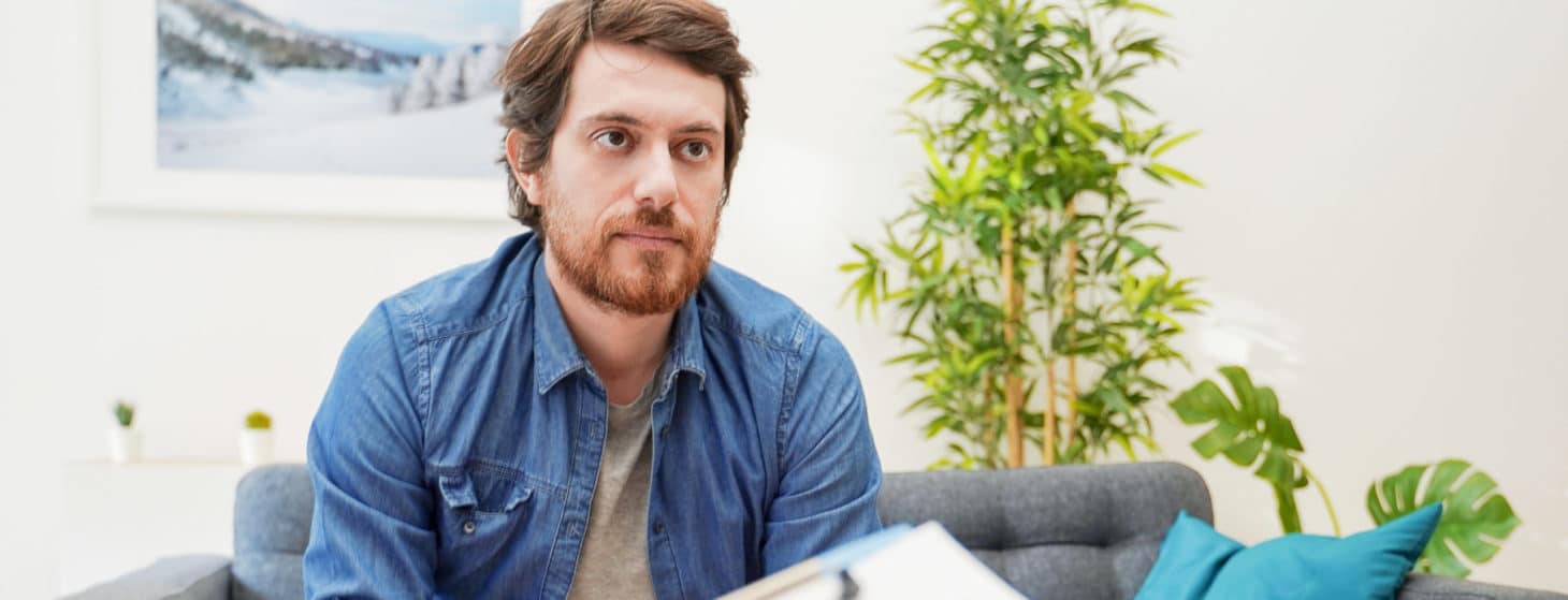 Psychologist doctor taking notes during psychotherapy session