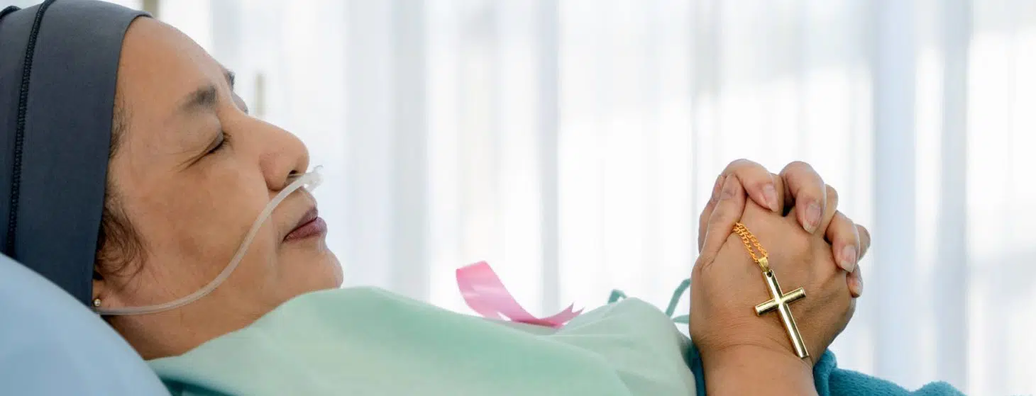 woman patient praying rosary