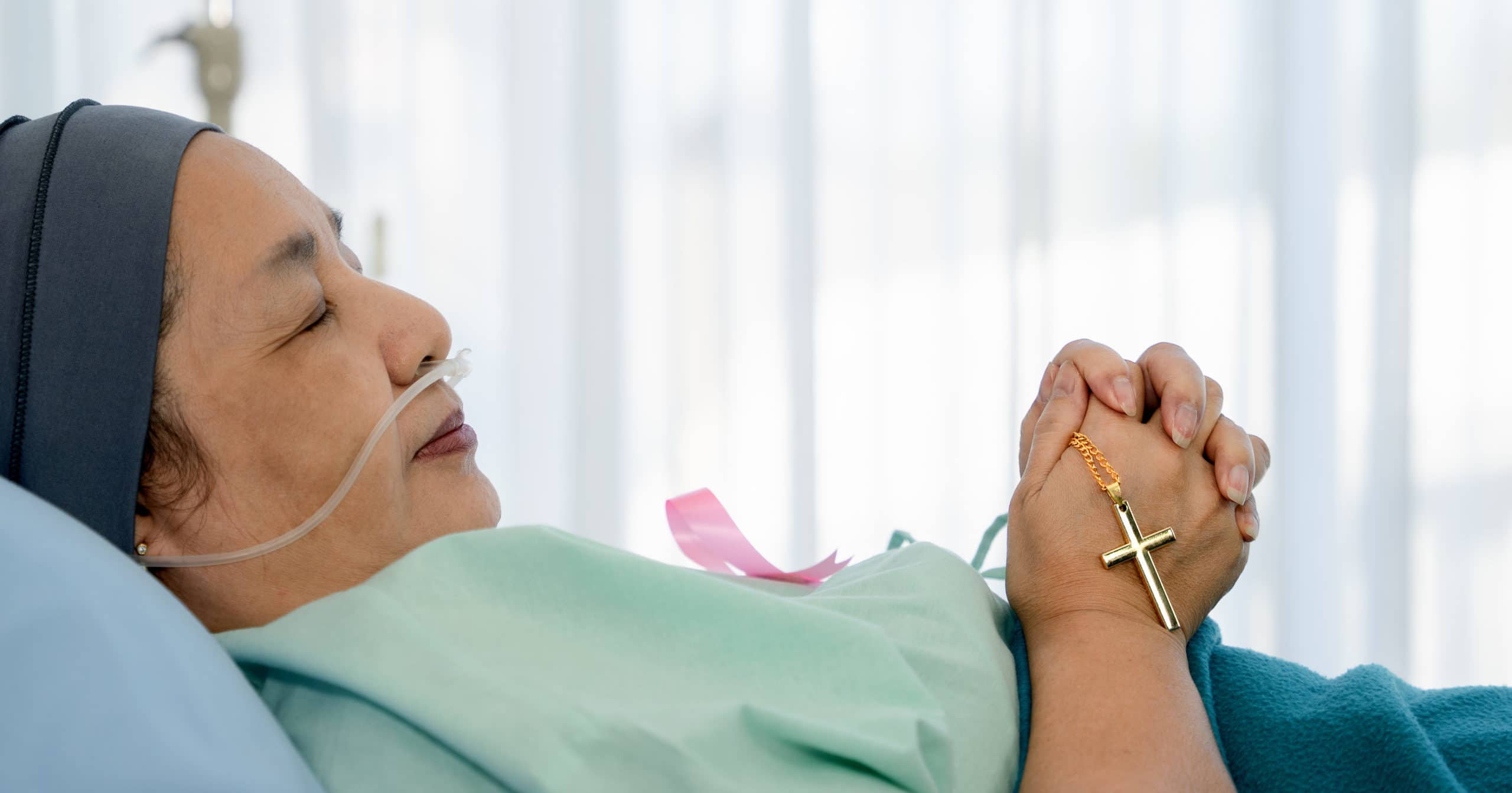 woman patient praying rosary