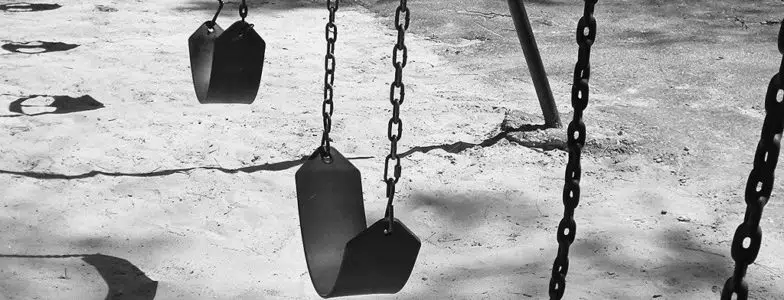 Empty swings representing antinatalism